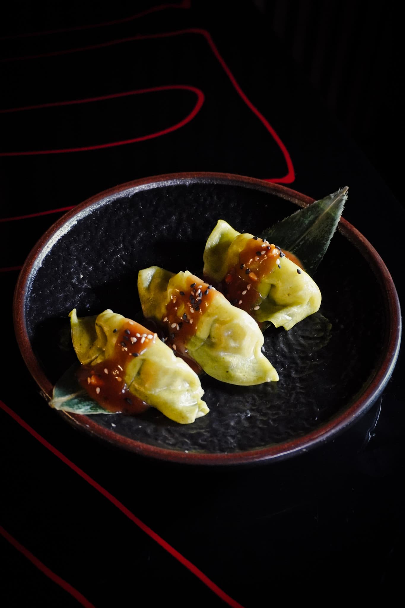 Japanese gyoza dumplings with sesame peanut ponzu sauce.